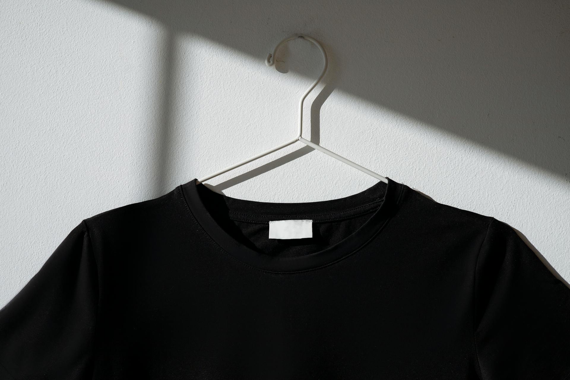 minimal black cotton t-shirt on hanger